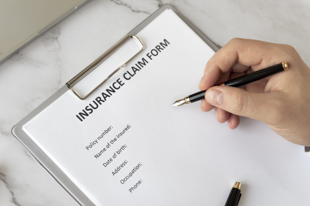 Image of a group health insurance claim form, featuring sections for personal information and medical expenses.jpg